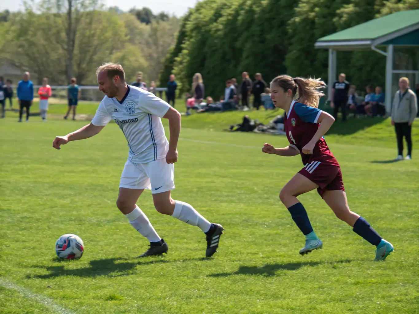 An action shot of a competitive football match featuring adult players, highlighting the intensity and excitement of the game.